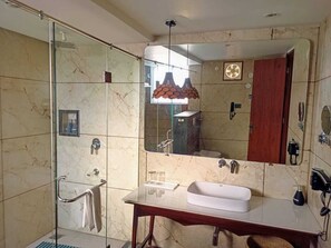 Blizz Suites | Bathroom | Shower, hair dryer, slippers, towels - DUDHWA NIRWANA RETREAT (Palia Kalan)