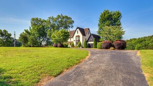 A large house with a driveway leading to the entrance. - Home w/ Fire Pit on 27 Acres in Walhalla! (Walhalla)