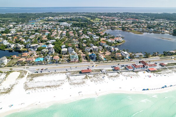 An aerial view of a coastal town with residential areas, a beach, and a marina. - Worth The Wait 3 Bedroom Home by RedAwning (Destin)