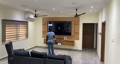 Cozy 3-bedroom apartment in Kasoa with AC, WiFi, water heater, solar power