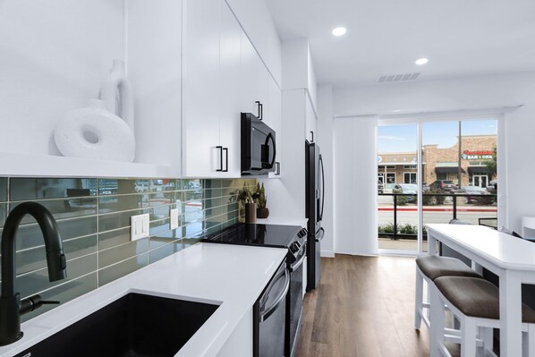 Condo, 1 Queen Bed with Sofa bed, Patio, City View (Poolside Suite) | Private kitchen