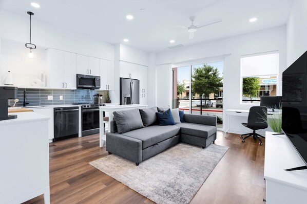 Condo, 1 Queen Bed with Sofa bed, Patio, City View (Poolside Suite) | Living area