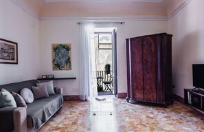 Apartment, Balcony | Living area | 35-inch TV with digital channels - La Maison di Ortigia by Wonderful Italy (Syracuse)