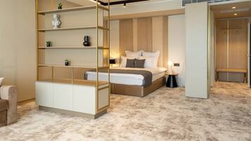 A modern bedroom with a bed, bedside tables, a built-in bookshelf, and a bench.