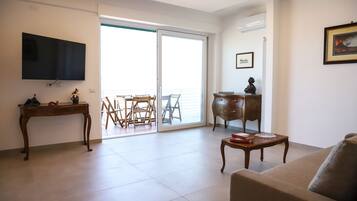 Apartment, Bay View | Living area | 35-inch TV with digital channels