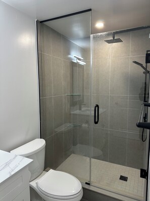 Shower, hair dryer, towels, soap