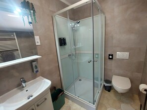 Shower, hair dryer, towels, soap