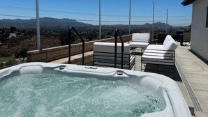 A hot tub with a clear view of mountains in the background. - "The Best" Jacuzzi View Private Luxury Guest Cottage-Better than a Room or Suite (Thousand Oaks)