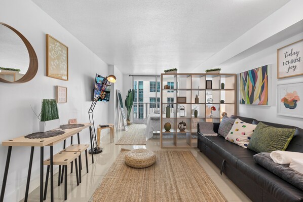 Luxury Studio, 1 Bedroom, City View | Living area | 50-inch Smart TV with cable channels, foosball