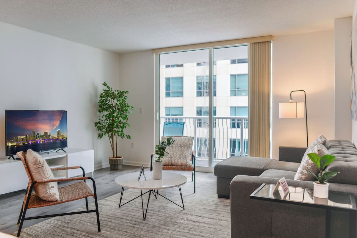 Luxury Condo, 1 Bedroom, Partial Ocean View | Living area | 50-inch Smart TV with cable channels, foosball