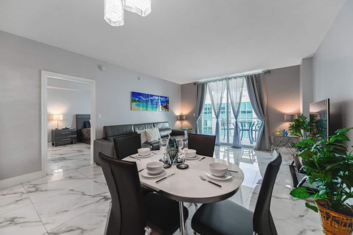 Luxury Condo, 1 Bedroom, Partial Ocean View | Living area | 50-inch Smart TV with cable channels, table football