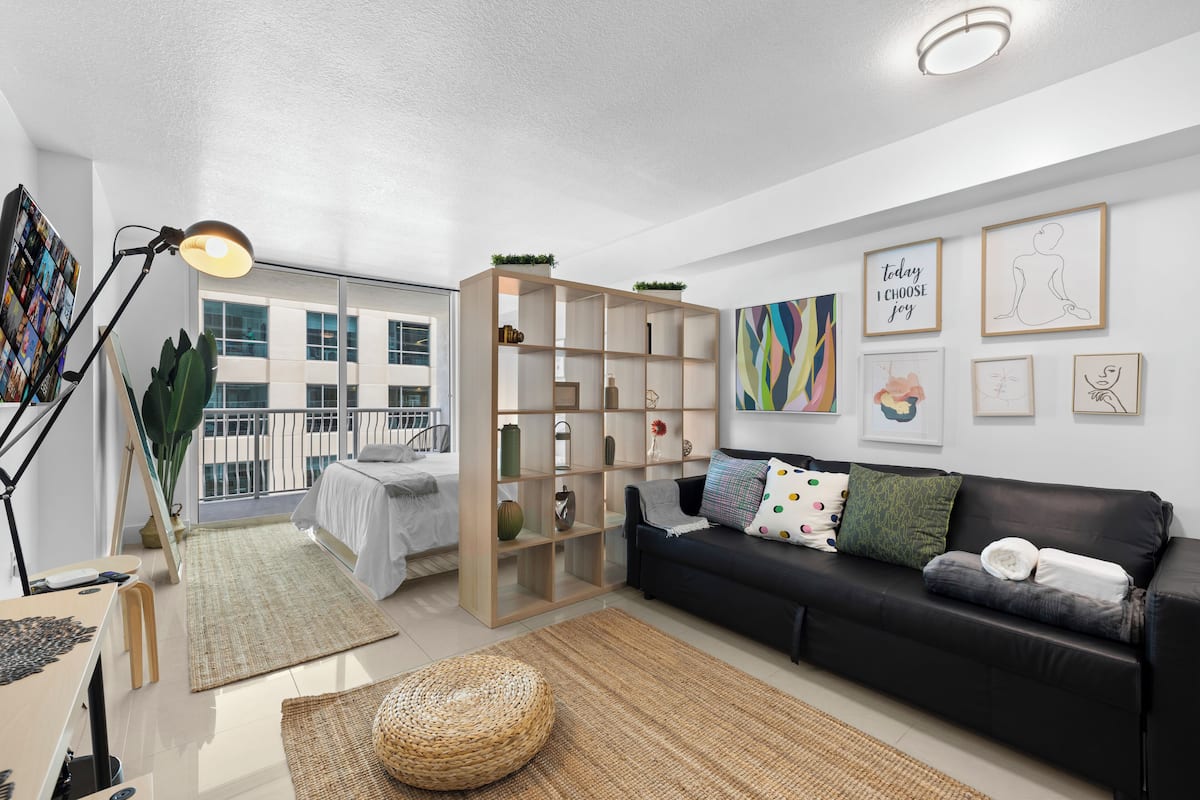 Luxury Studio, 1 Bedroom, City View | Living area | 50-inch Smart TV with cable channels, foosball