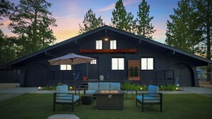 Ein modernes Haus mit einer Terrasse, die Gartenmöbel und eine Feuerstelle bietet.
