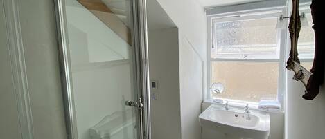 Shower, hair dryer, towels, soap