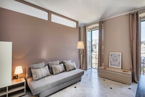 Apartment, City View | Living area | 32-inch flat-screen TV with digital channels