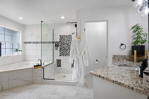 Jetted bath, hair dryer, towels, soap