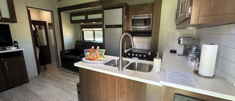 Fridge, microwave, stovetop, coffee/tea maker