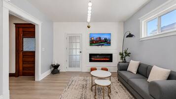 Smart TV, fireplace, table football, books
