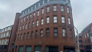 A multi-story building with a curved corner, featuring a sign that reads "Abbey Corner." - Luxury One Bedroom Apartment in Berkshire  (Reading)