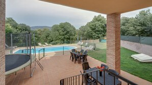 A covered patio area with a pool, outdoor furniture, and a view of the surrounding landscape. - Holiday Home 'Sueños De Guara Casa Rural' with Mountain Views, Private Pool and Wi-Fi (Casbas de Huesca)