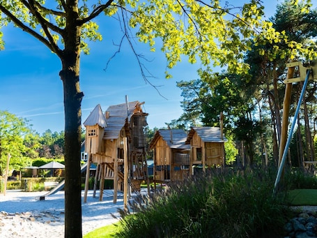 Chalet | Exterior. Chalet by Pond in Holiday Park