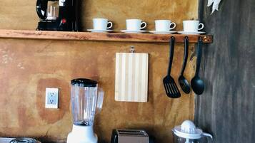 Mini-fridge, stovetop, electric kettle, cookware/dishes/utensils