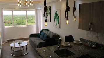 Deluxe Apartment | Living area | Flat-screen TV