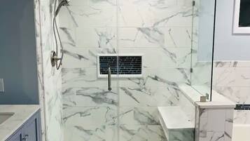 Shower, hair dryer, towels, soap