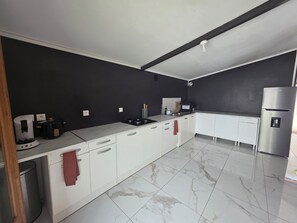 Fridge, microwave, stovetop, coffee/tea maker