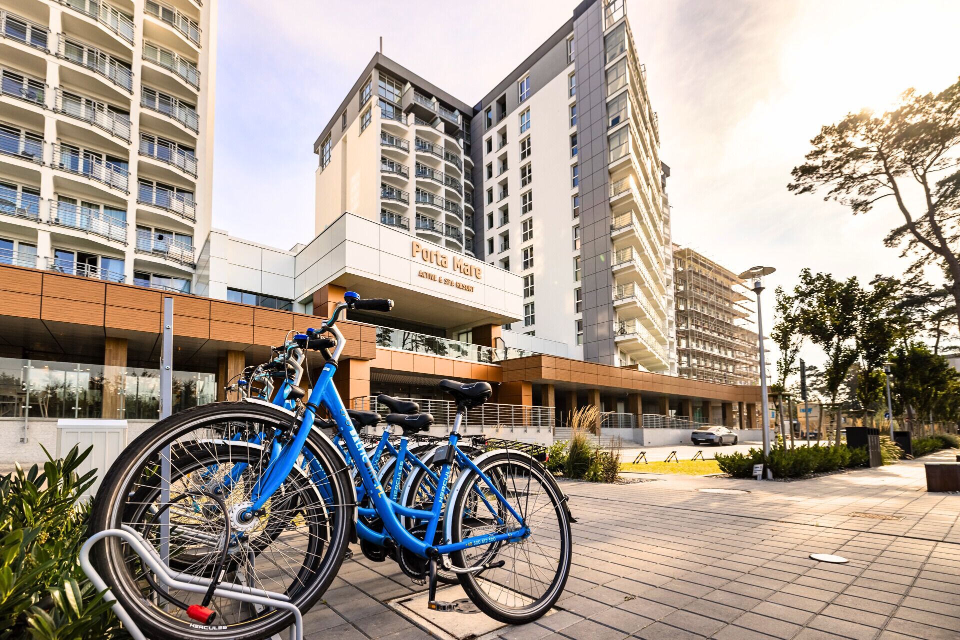 A modern building with a sign reading "Porta Mare Active & Style Resort."