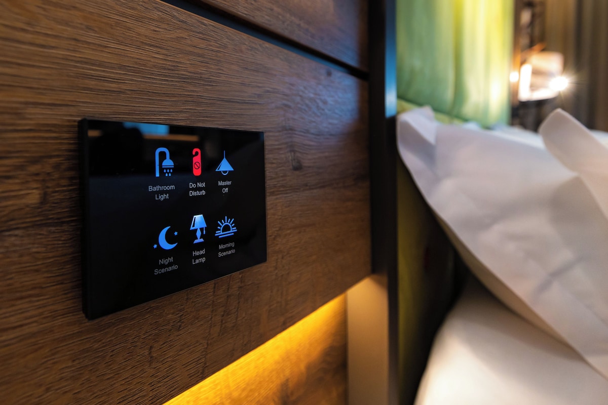 A control panel with icons for bathroom light, master off, night scenario, head lamp, and morning scenario.