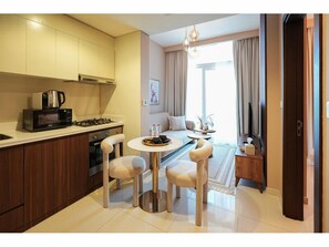 Deluxe Apartment, 1 Bedroom, Balcony, Lake View | Private kitchen | Fridge, oven, stovetop, coffee/tea maker