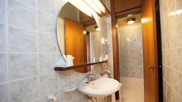 Shower, hair dryer, slippers, towels