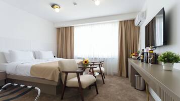 Double or Twin Room, City View | Living area | 40-inch Smart TV with cable channels