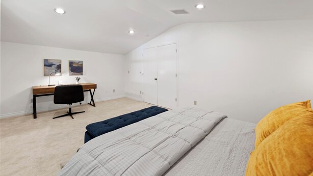 A bedroom with a bed, a desk, a chair, and a wardrobe. - Stunning Sammamish Lake View Home near Weowna Park (Bellevue)