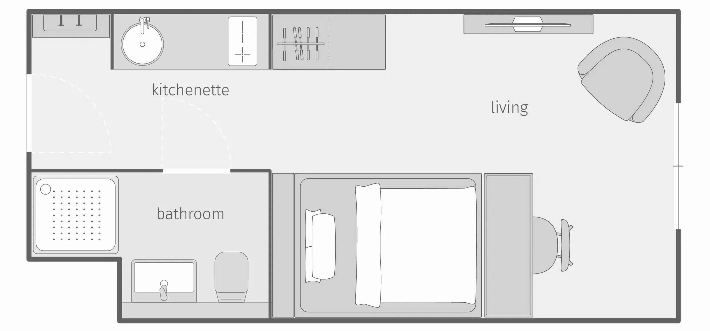 A floor plan of a hotel room with a kitchenette, bathroom, and living area.
