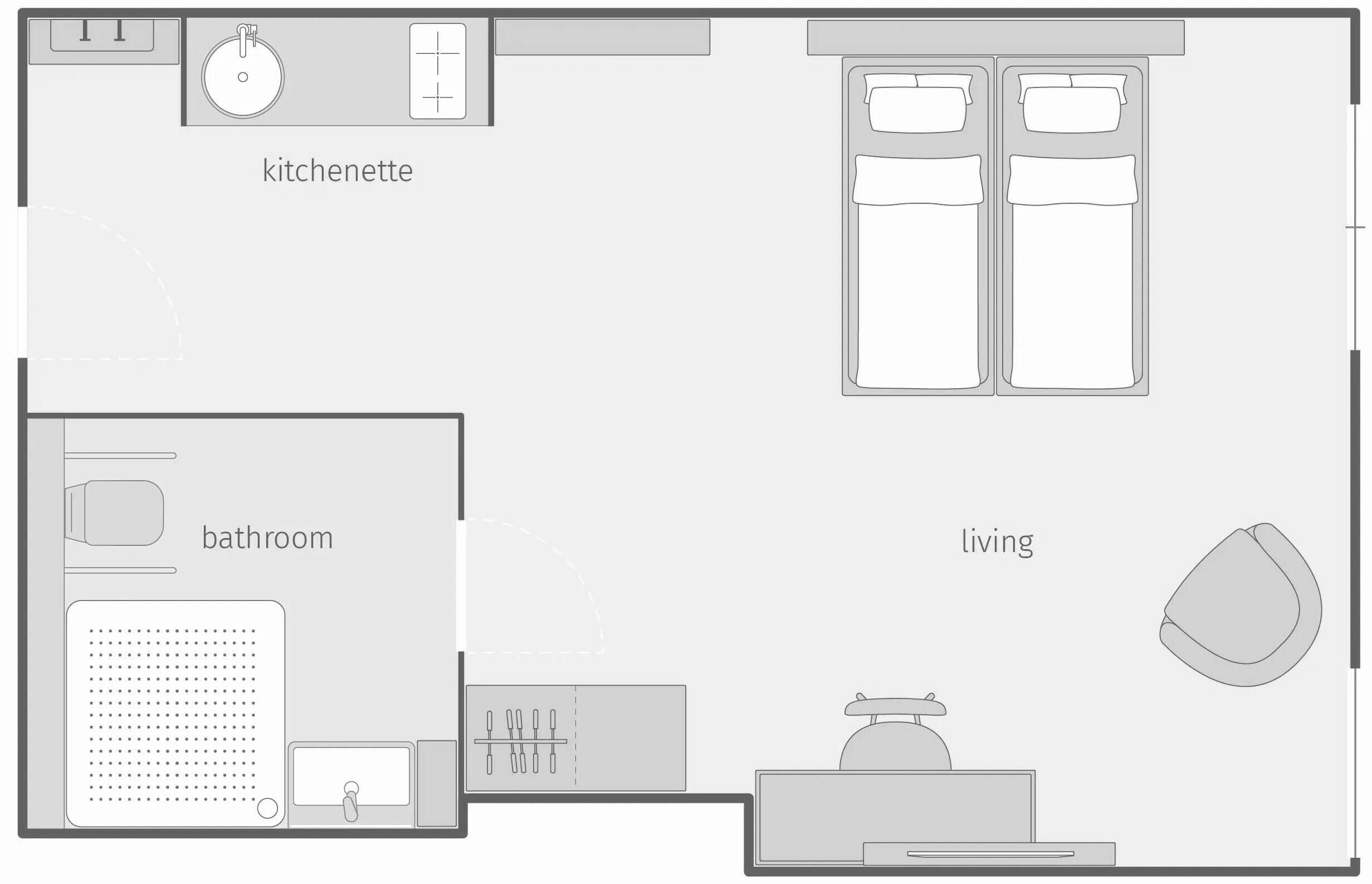 A floor plan of a hotel room with a kitchenette, bathroom, and living area.