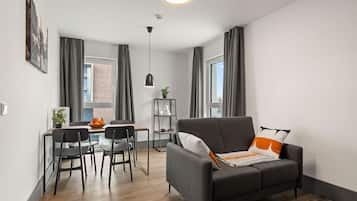 Apartment | Living area | 40-inch flat-screen TV with satellite channels
