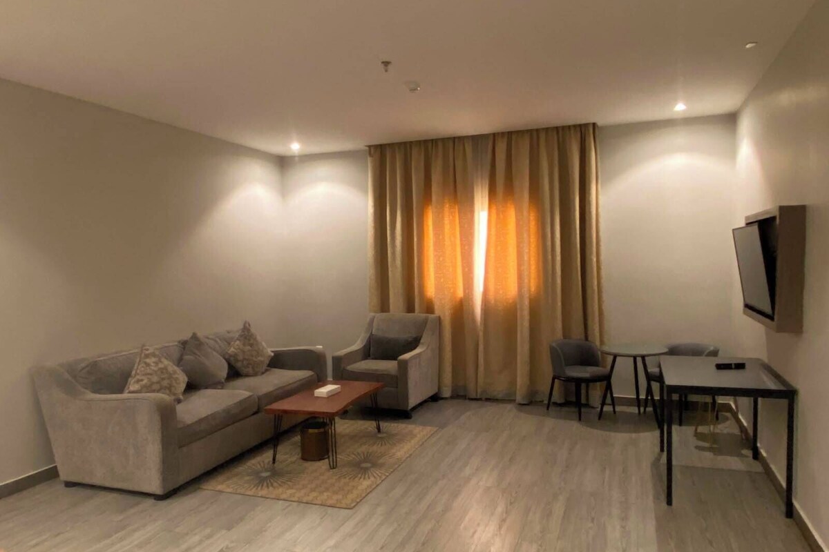 Family Apartment | Living area | 50-inch flat-screen TV with cable channels