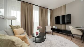 Apartemen, 1 kamar tidur, balkon | Ruang keluarga