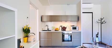 Fridge, coffee/tea maker, cookware/dishes/utensils