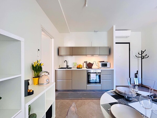 Fridge, coffee/tea maker, cookware/dishes/utensils