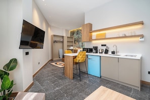 Mini-fridge, coffee/tea maker, electric kettle, highchair