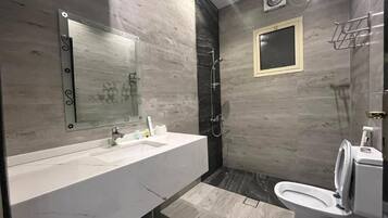 Executive Suite, 1 King Bed | Bathroom | Slippers, towels