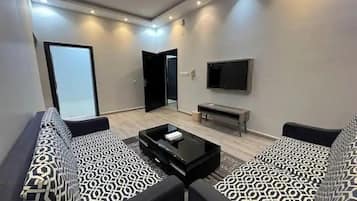 Departamento familiar, balcón | Sala de estar | Televisión de pantalla plana