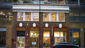 A building with a sign reading "CHARTER" and a sign for a book tour. - Chapter Aldgate - Campus Accommodation (London)