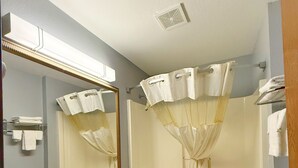 A bathroom with a sink, toilet, and bathtub.