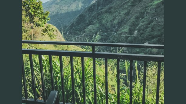 A balcony with a view of a mountainous landscape. - Ella Rock Mystery Hotel (Ella, Sri Lanka)