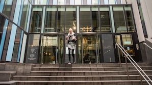 A modern building with a glass facade and a staircase leading to the entrance. - Chapter Kings Cross - Campus Accommodation (London)