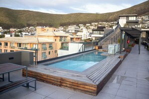 Outdoor pool - Stunning two-bedroom, two-bathroom apartment over looking Sea Point. 

 (Cape Town)